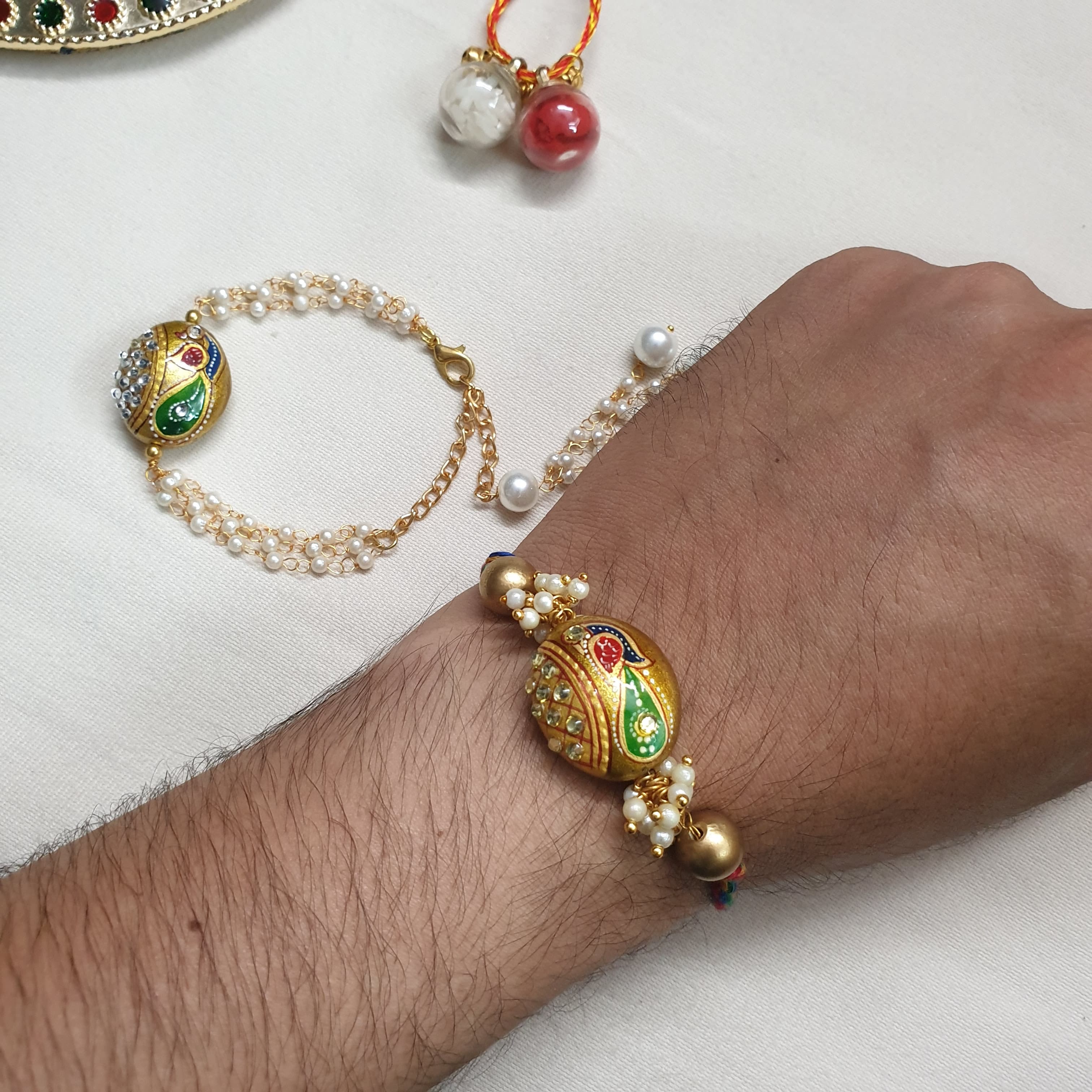Peacock Meenakari Rakhi Set For Couples