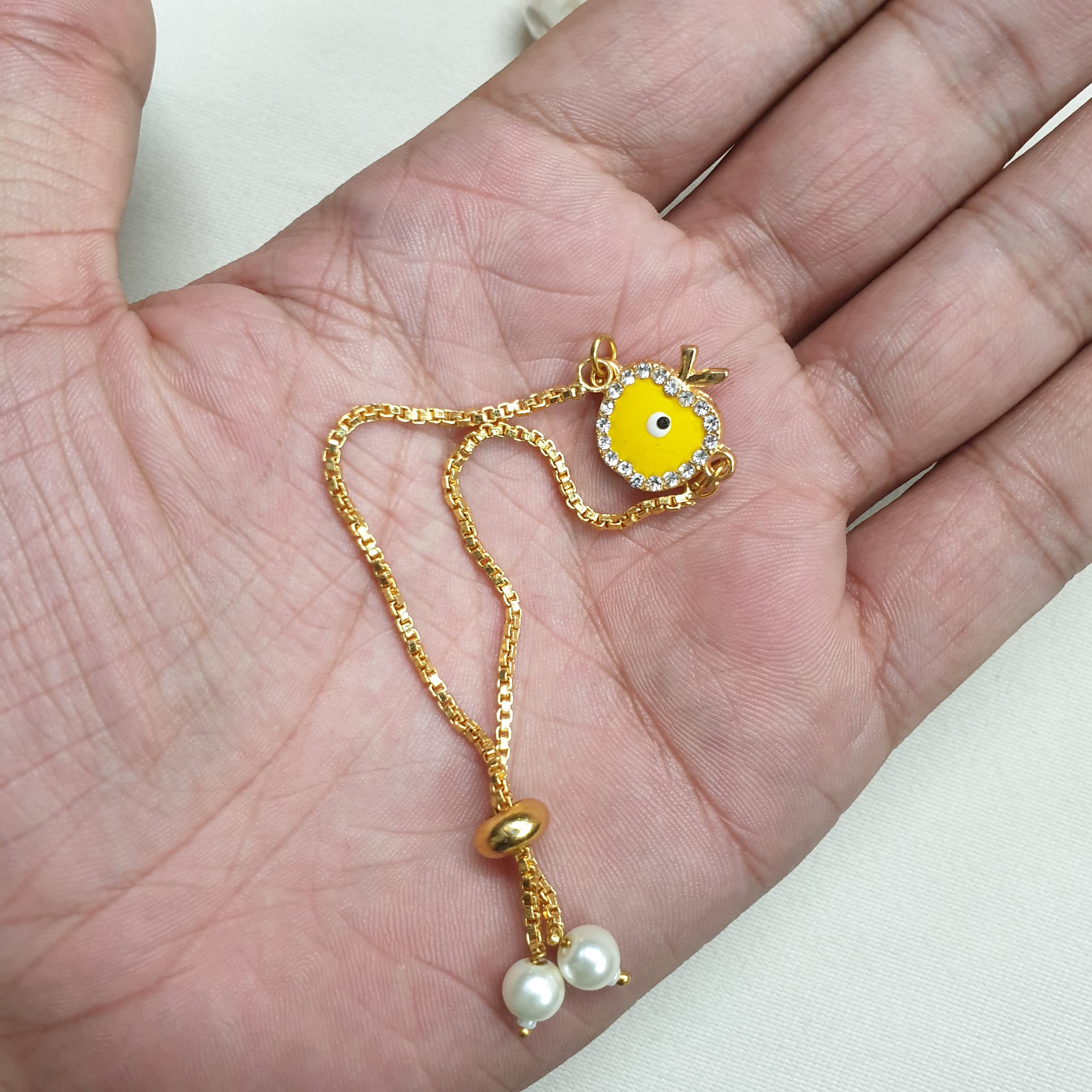 Yellow Apple Evil Eye Rakhi