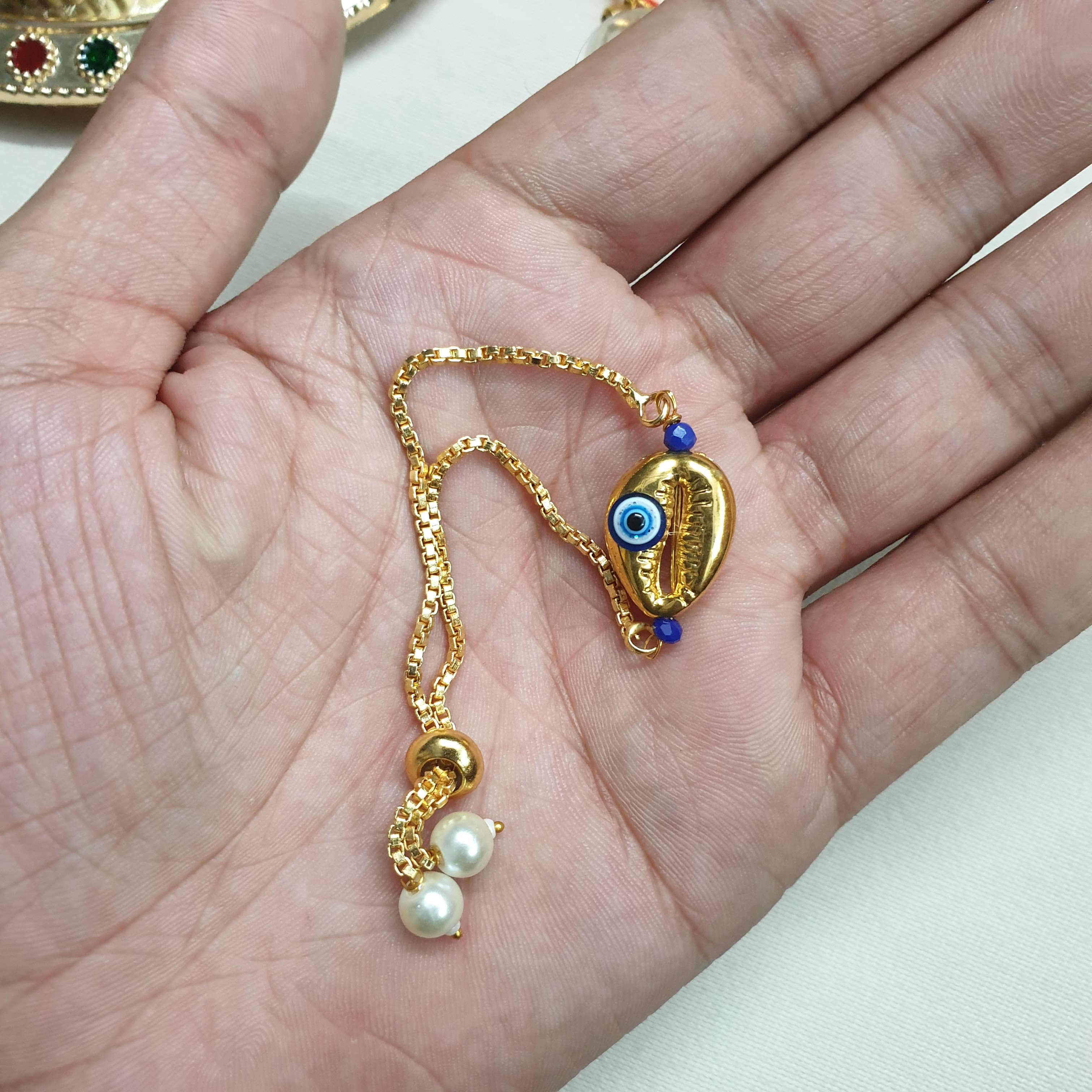 Cowrie Adjustable Evil Eye Rakhi
