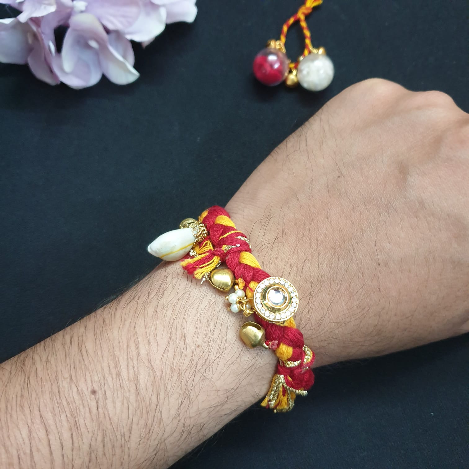 Cowrie Kundan Mauli Red Rakhi