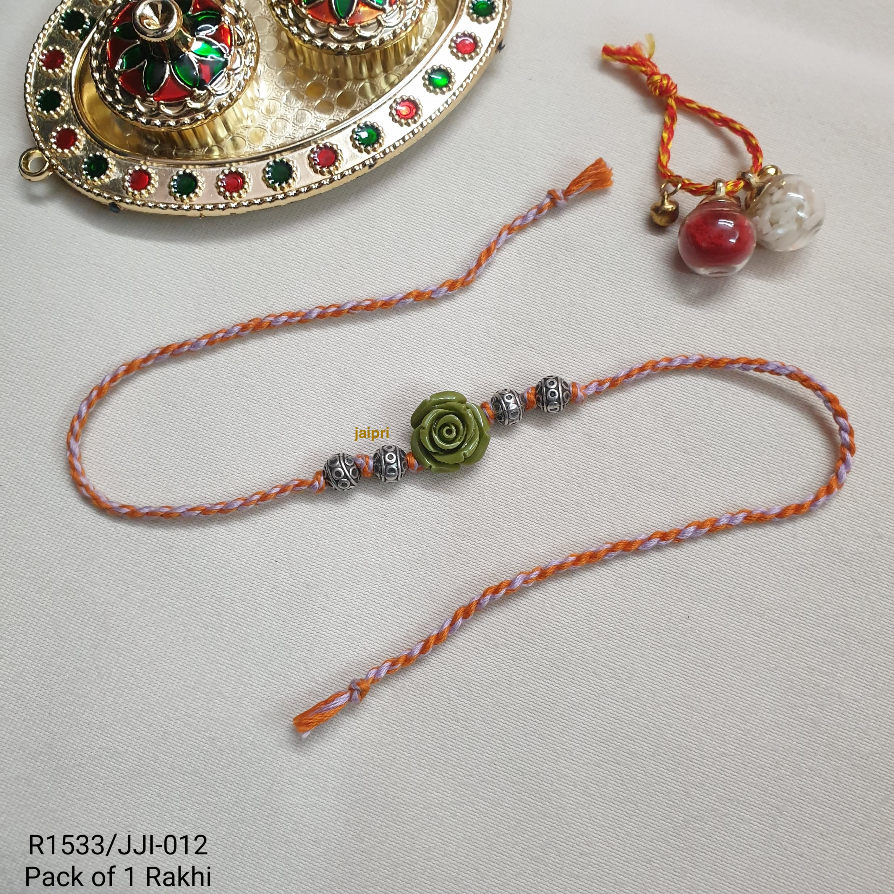 Silver LookaLike Floral Rakhi