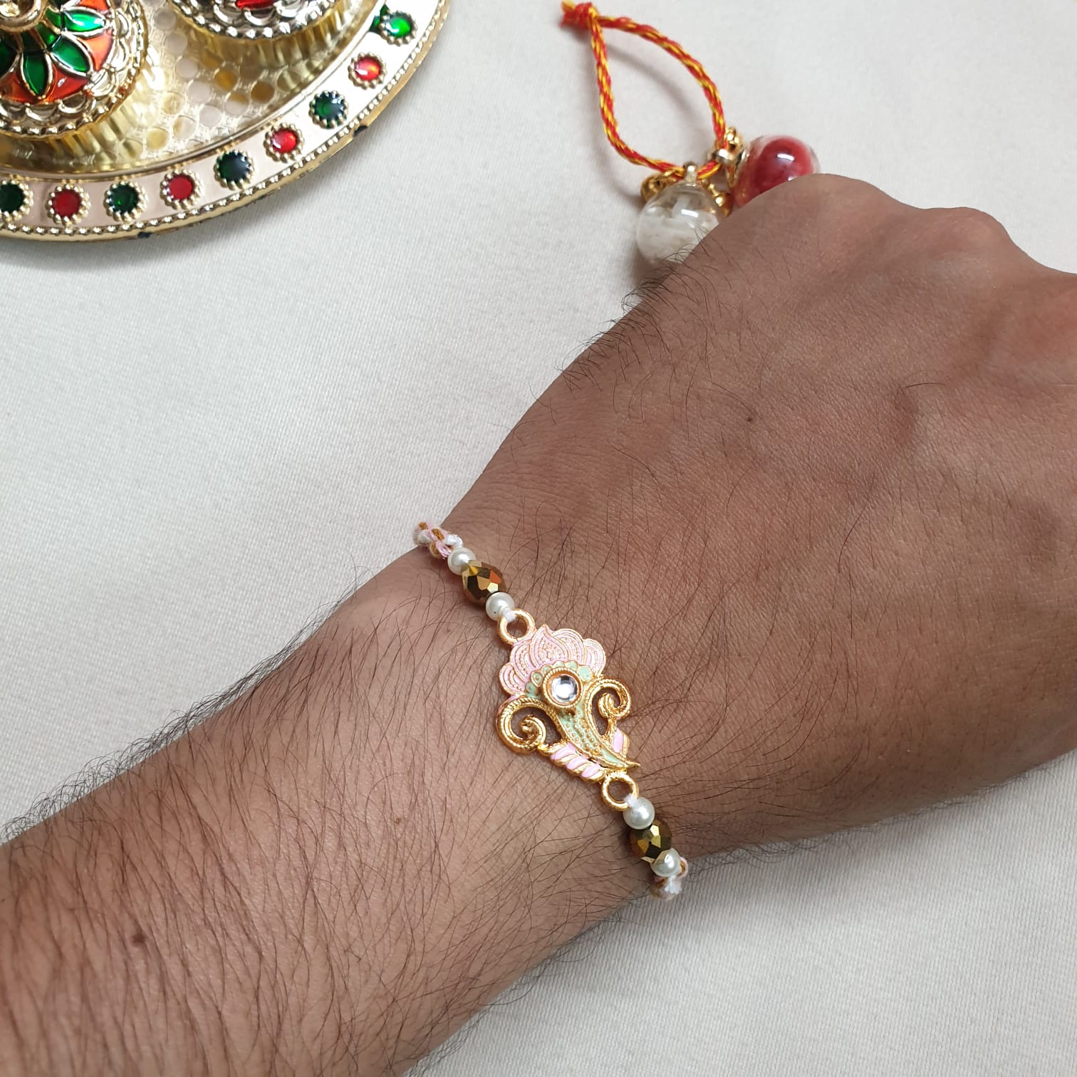 Pink Golden Bead Rakhi