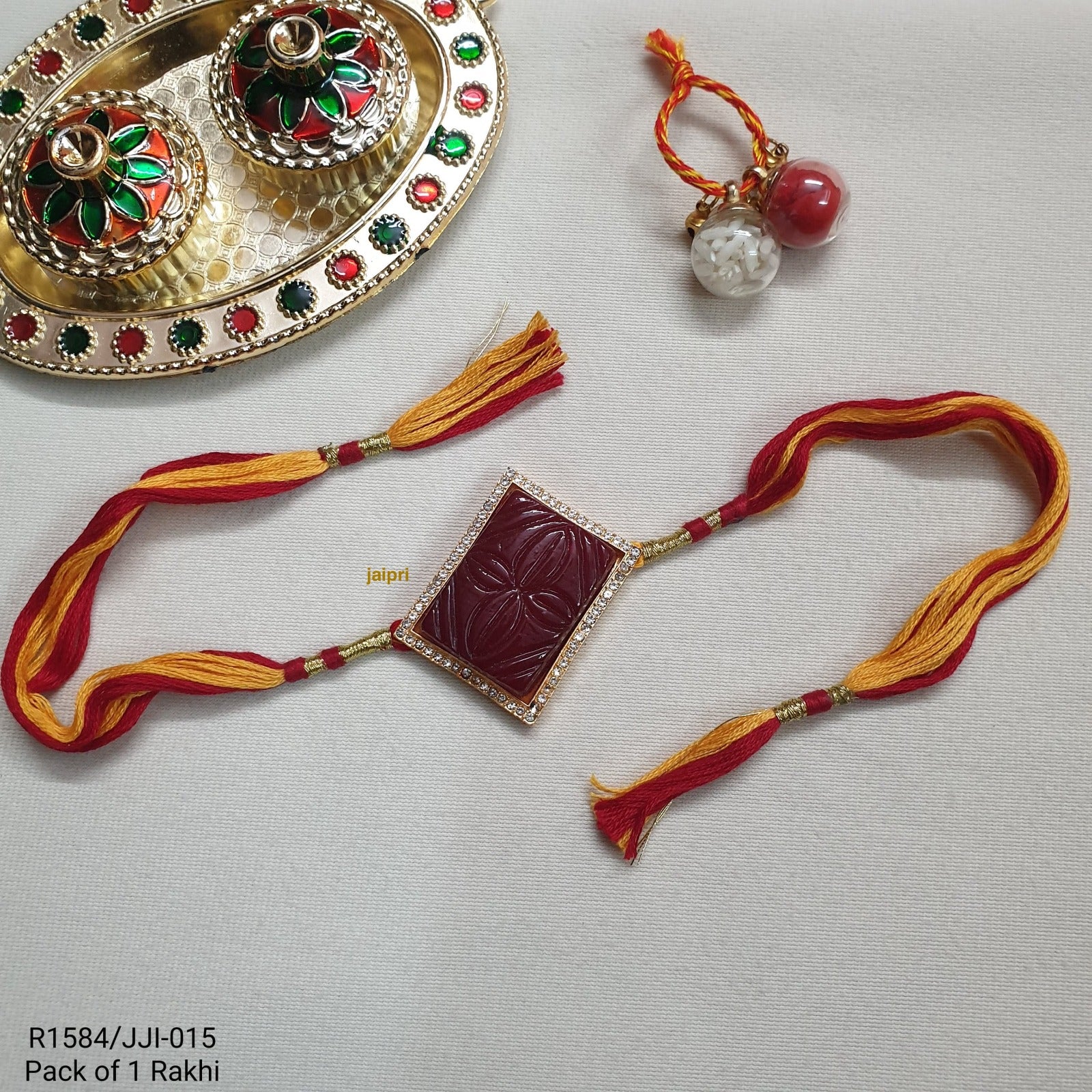Maroon Engraved Stone Rakhi