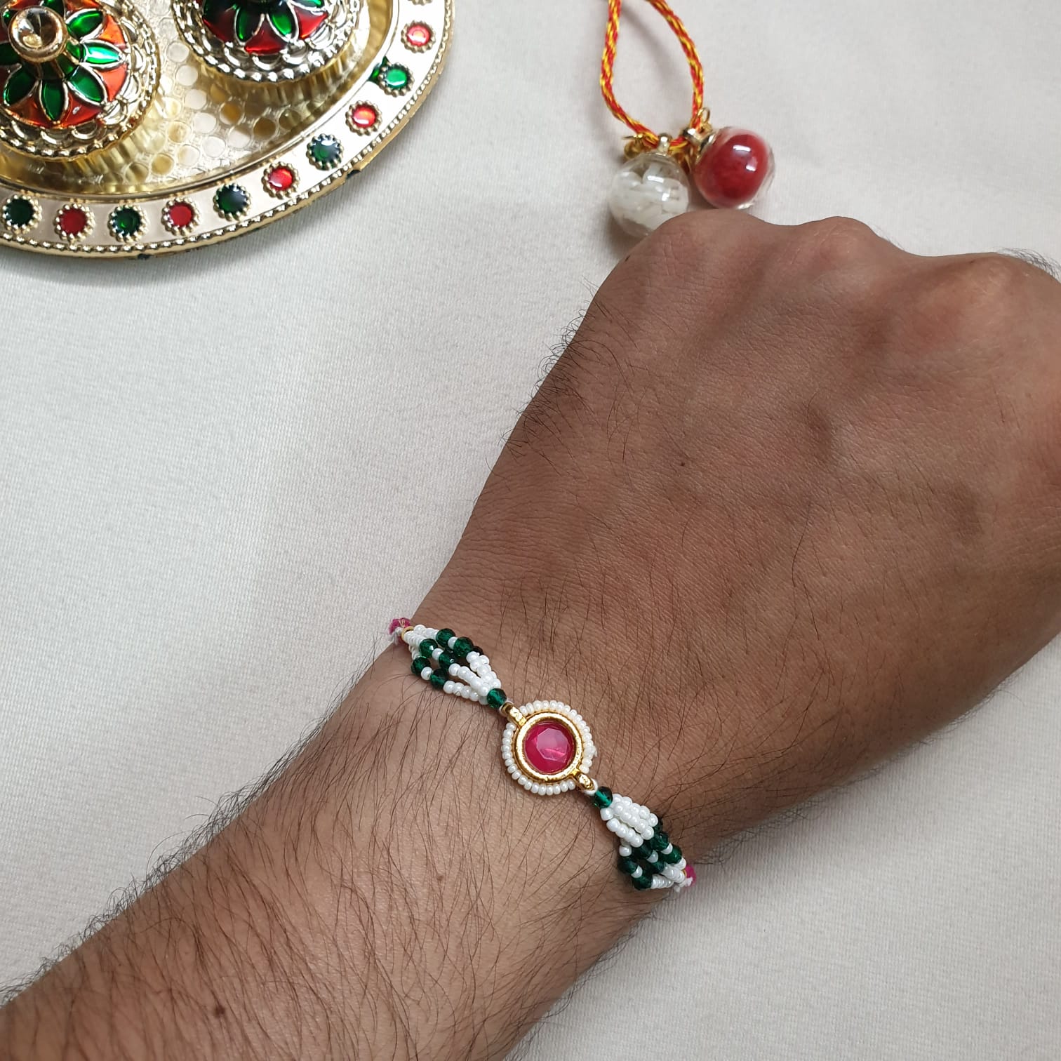 Pink Stone Green Seed Bead Rakhi