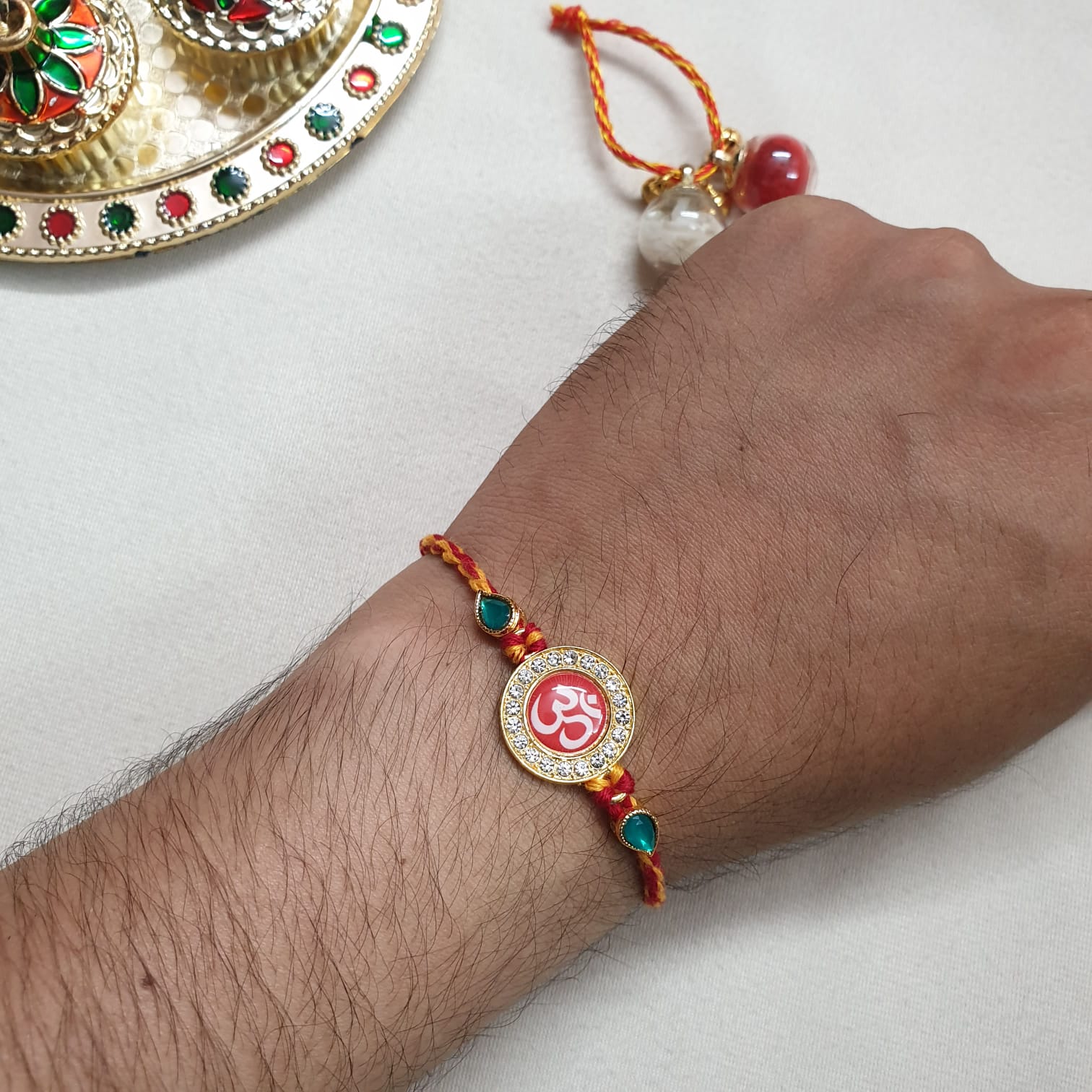 Om Green Stone Bead Rakhi For Brother