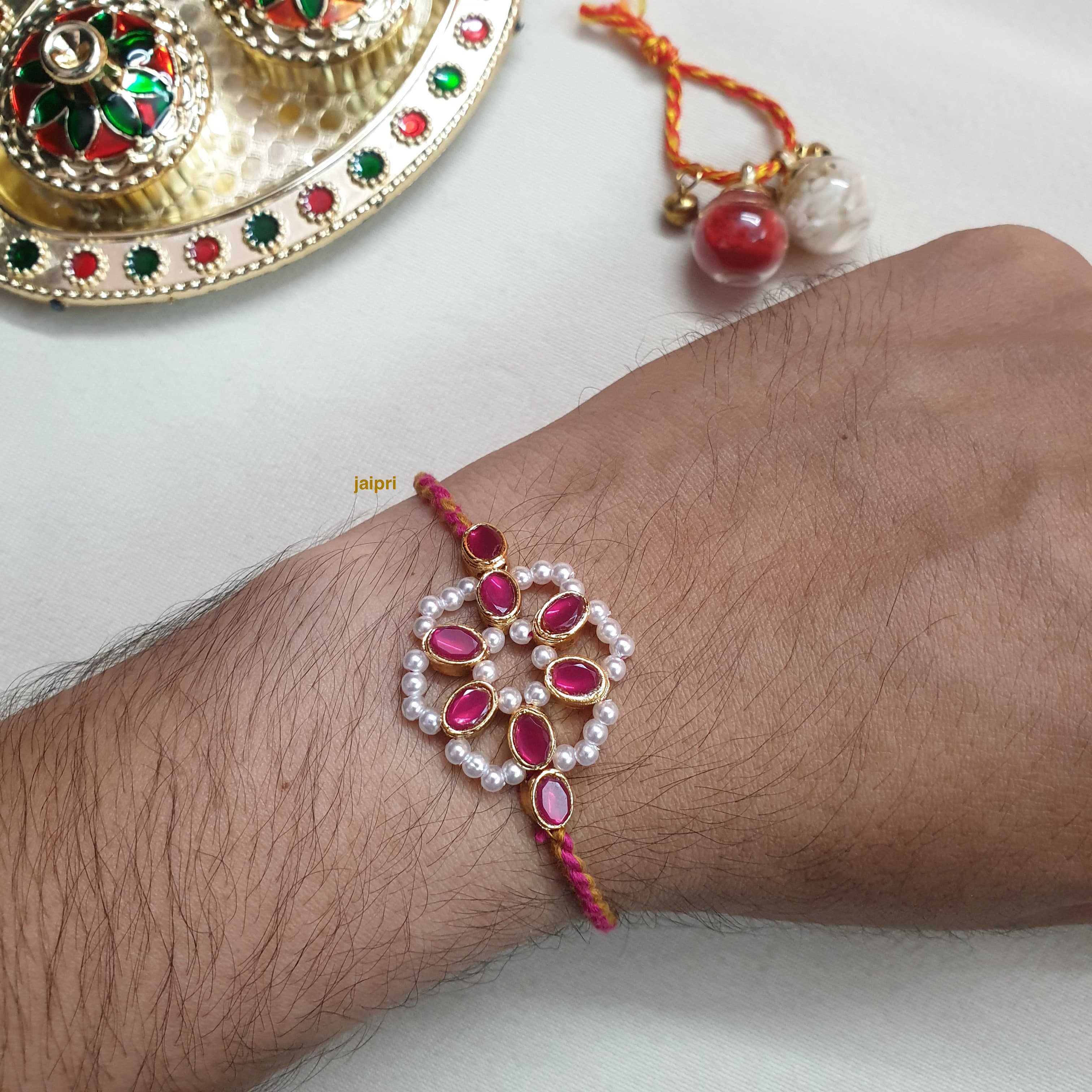 Pink Floral Pearl Rakhi For Brother