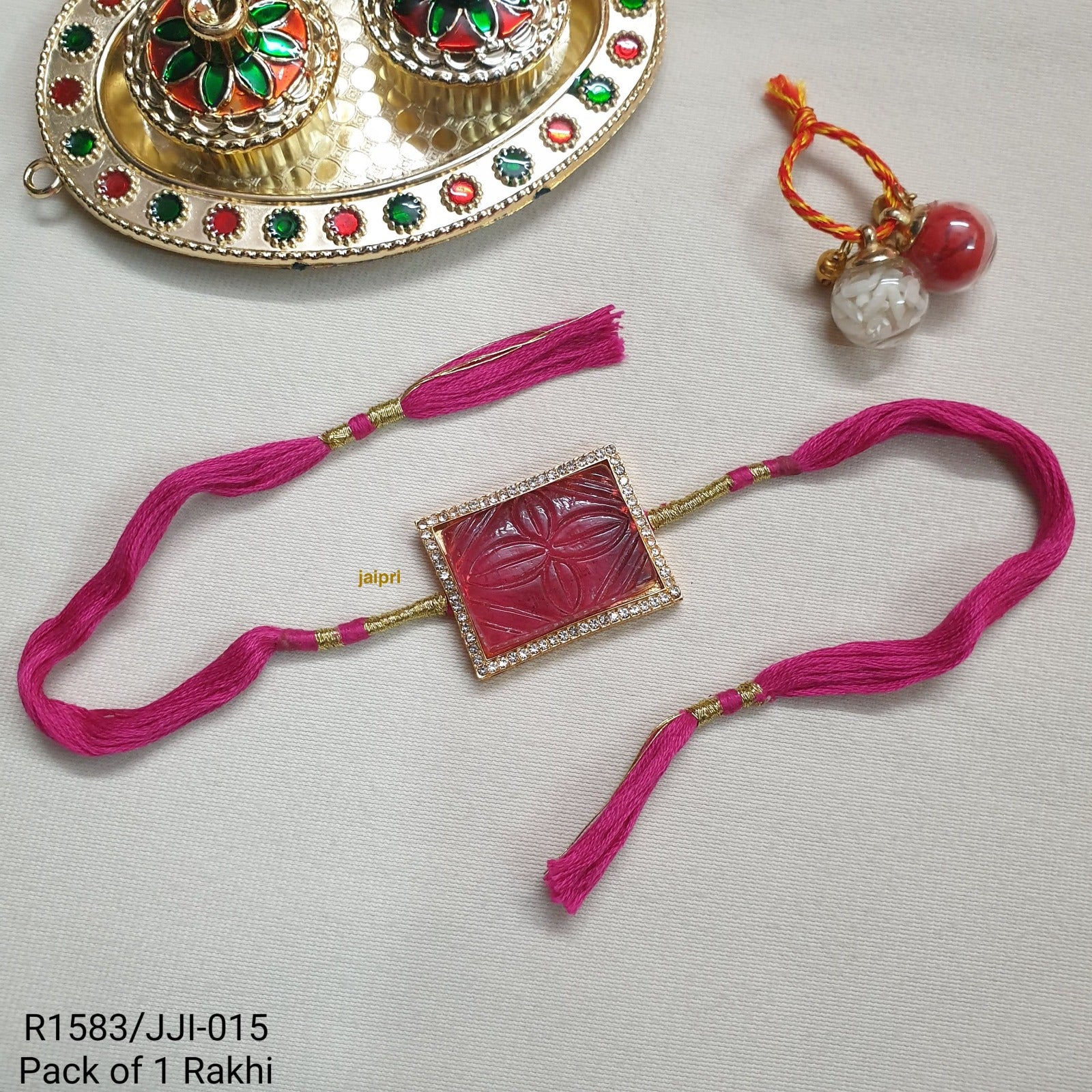 Pink Engraved Stone Rakhi