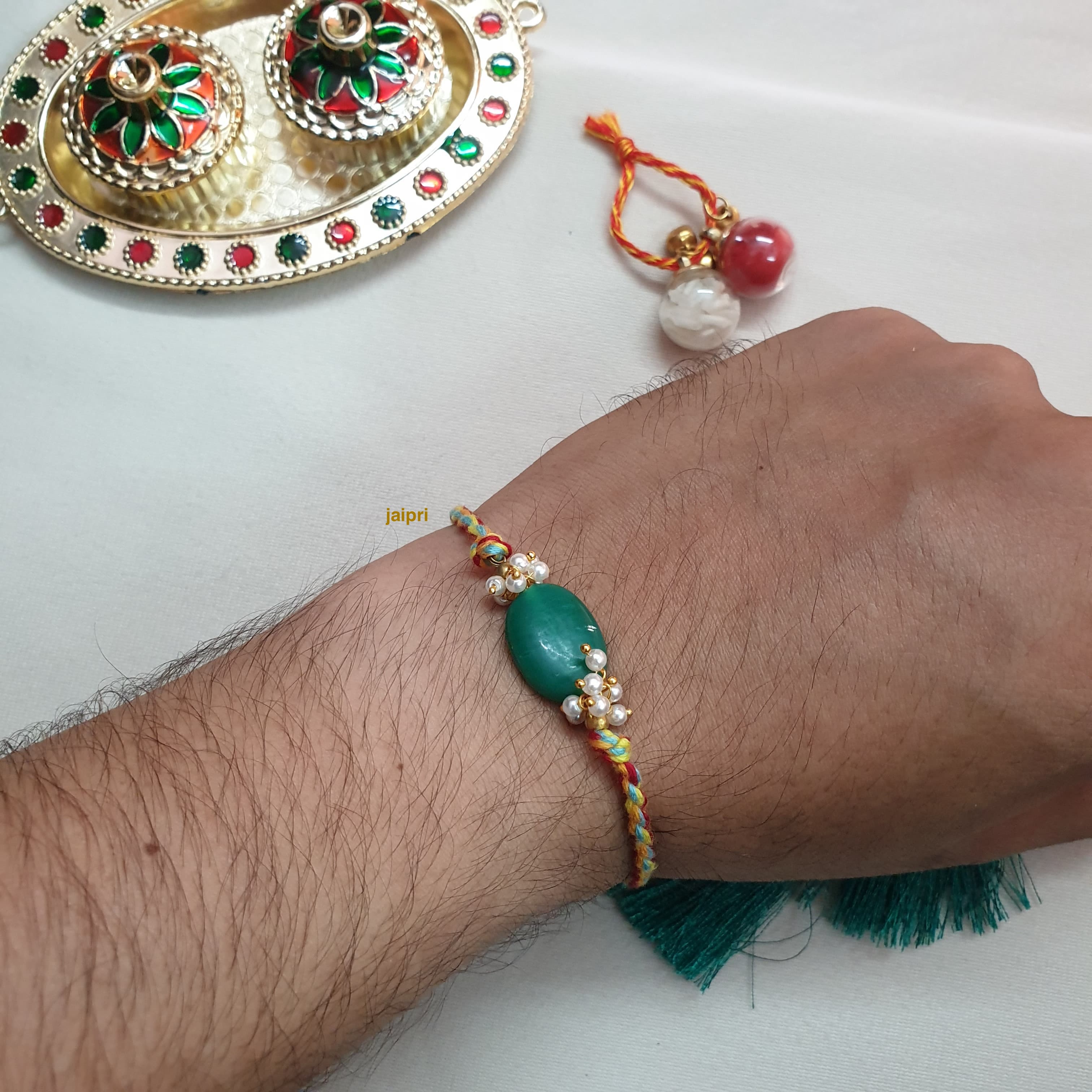 Green Stone Twisted Thread Rakhi