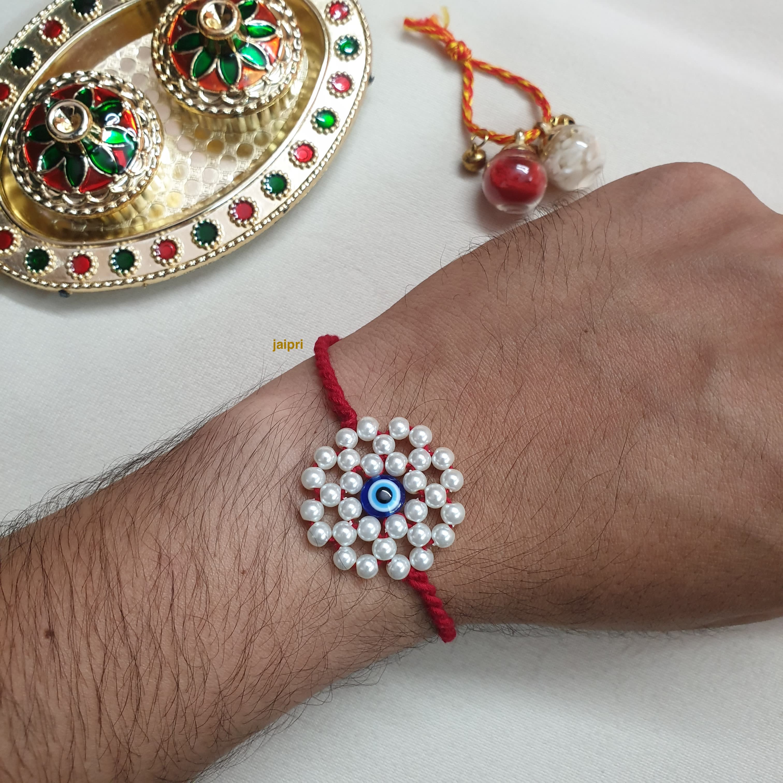 Pearl Floral Evil Eye Rakhi