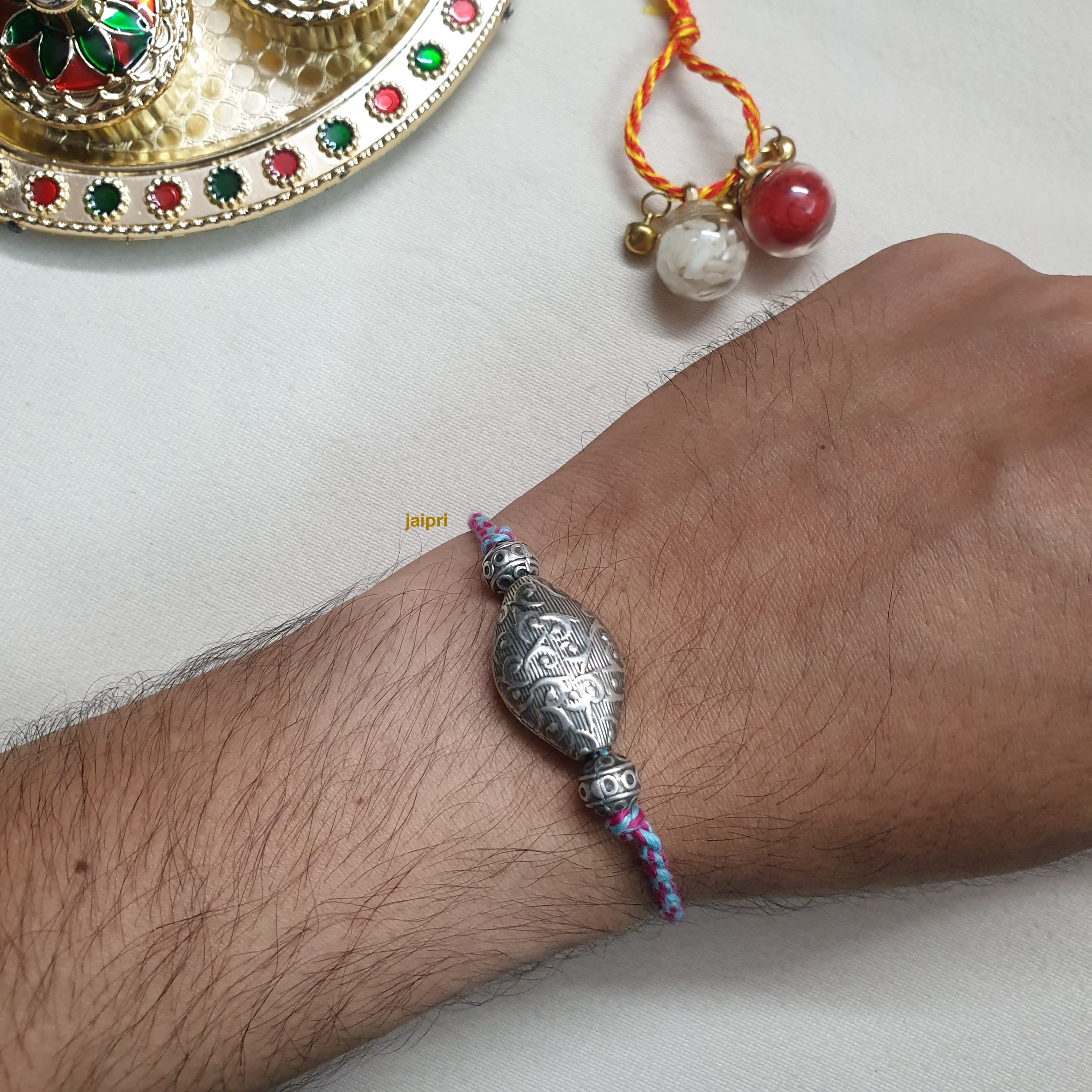 Silver LookaLike Oval Beads Rakhi