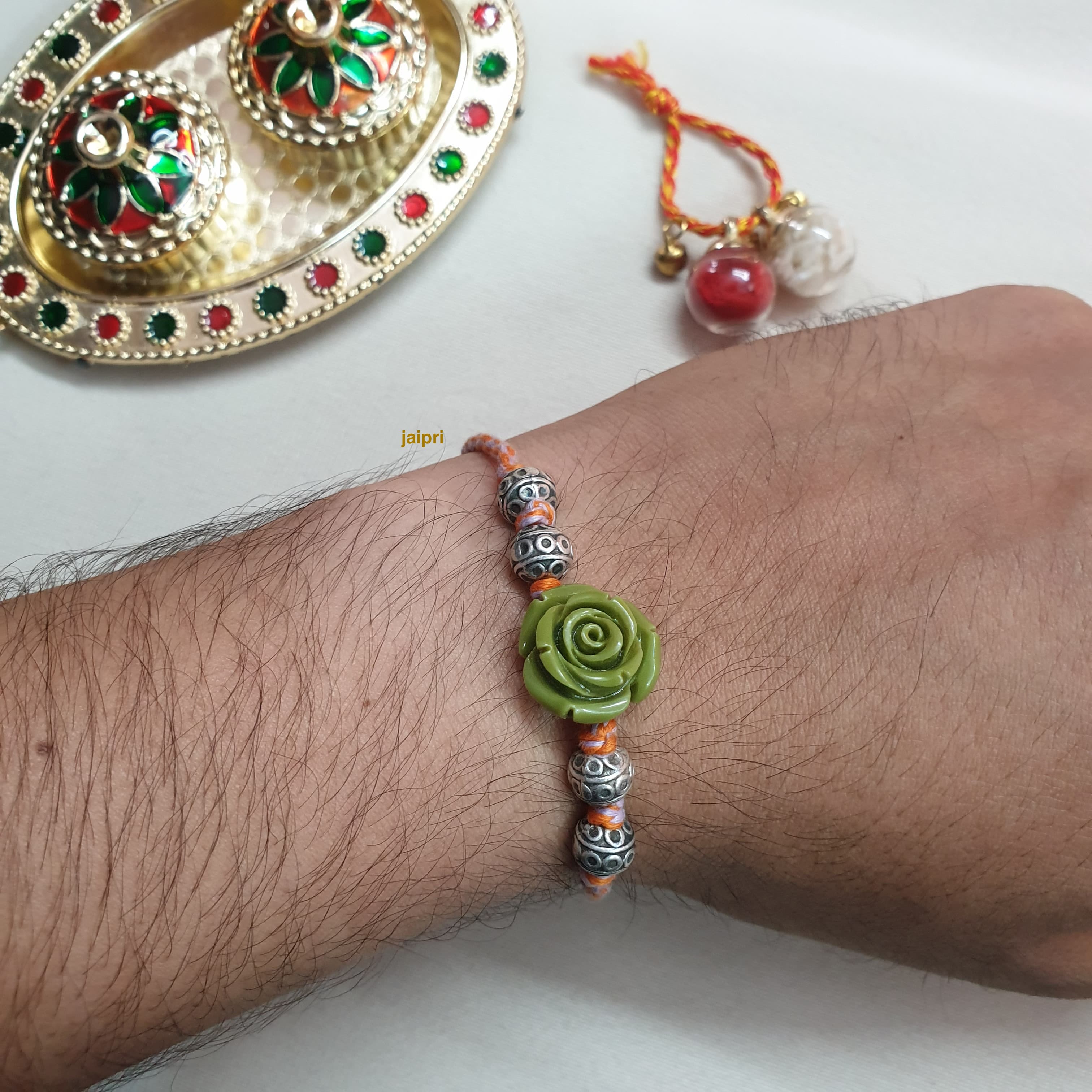 Silver LookaLike Floral Rakhi