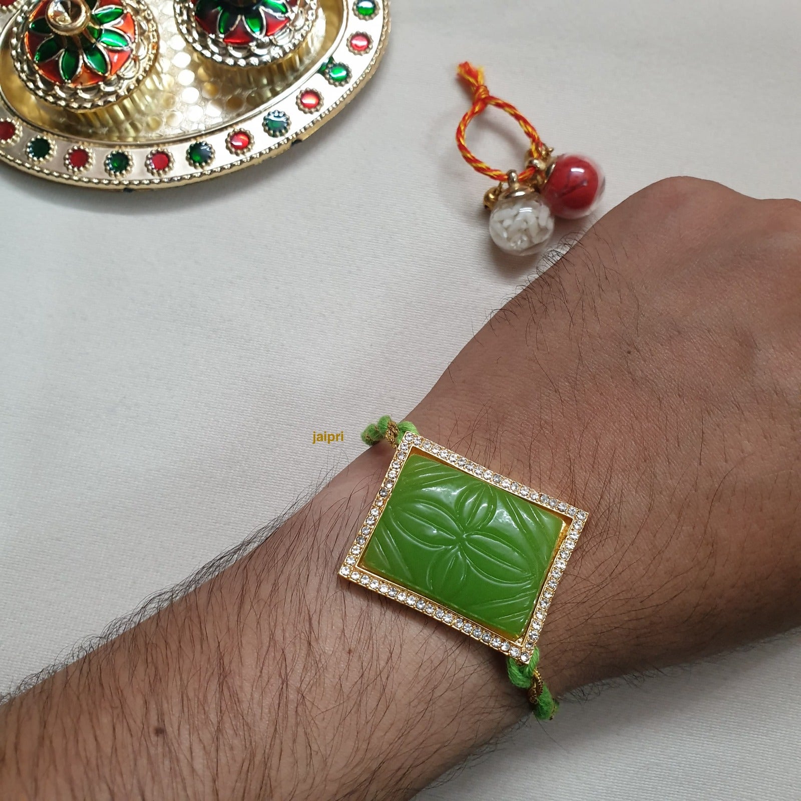 Green Engraved Stone Rakhi