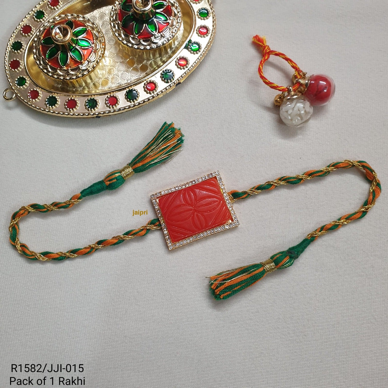 Orange Engraved Stone Rakhi