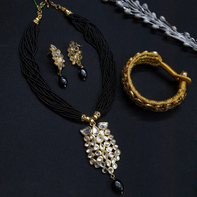 Kundan Pendant Set With Earrings And Bracelet