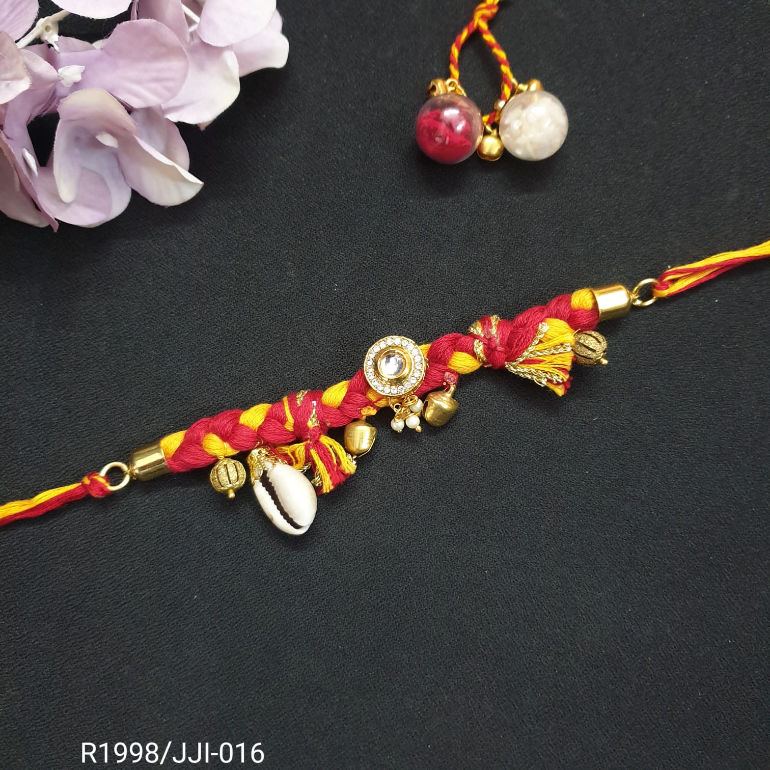 Cowrie Kundan Mauli Red Rakhi (Pack of One)