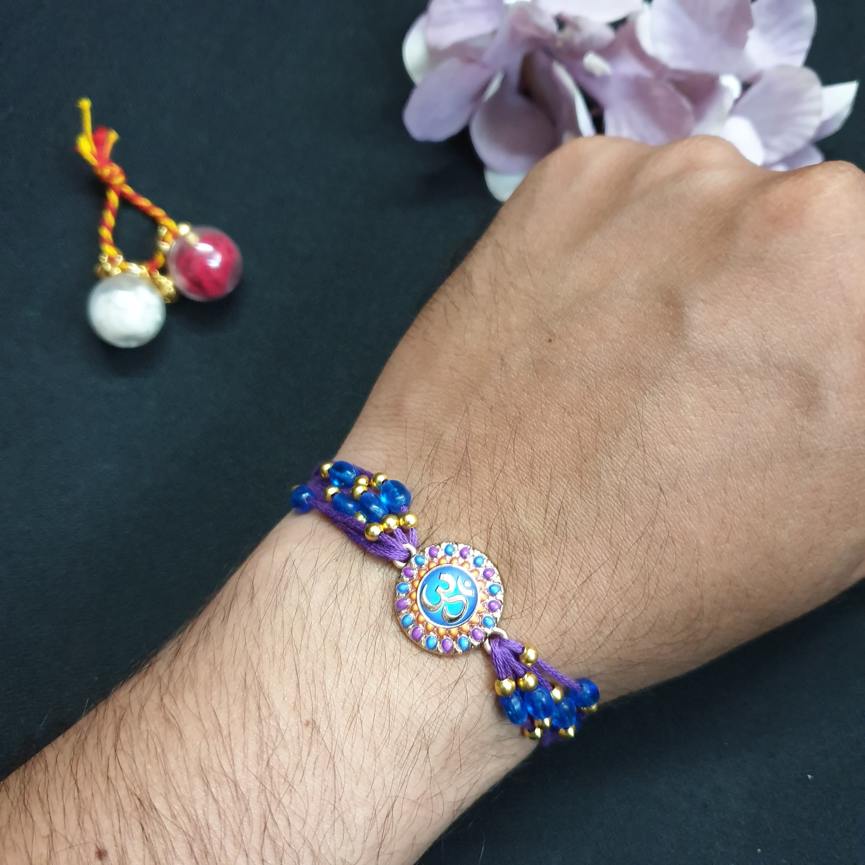 Purple Om Beaded Rakhi For Rakshabandhan
