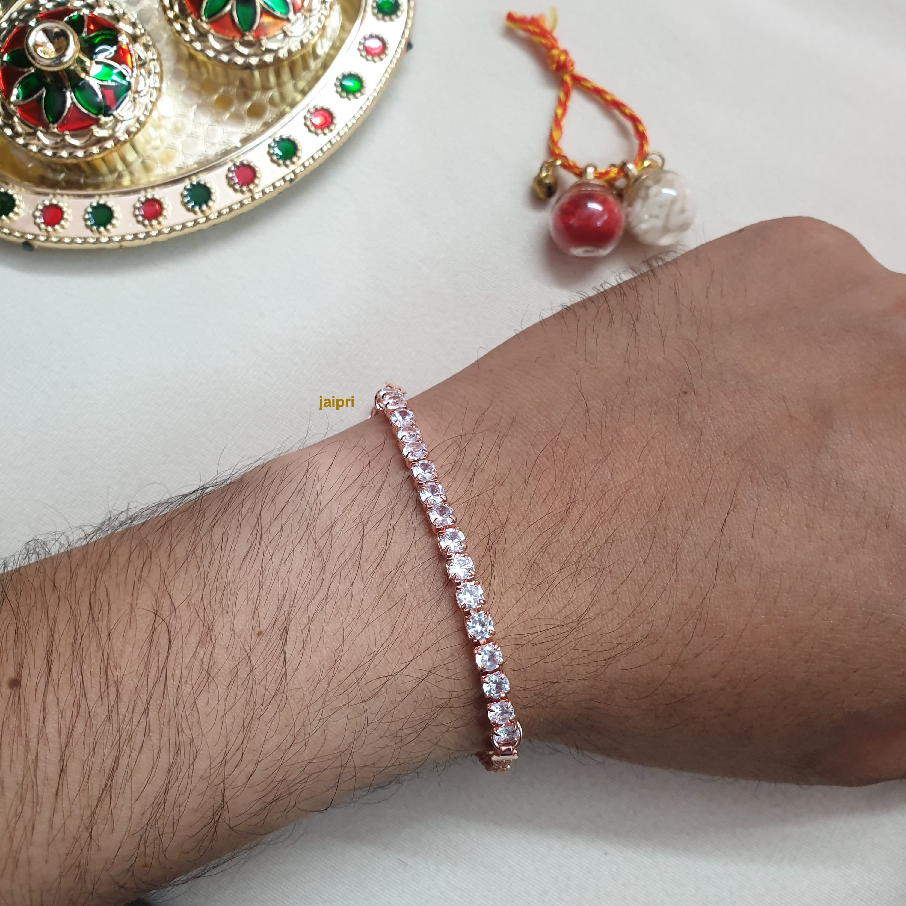White Stone Rose Gold Plated Rakhi (Pack of One)